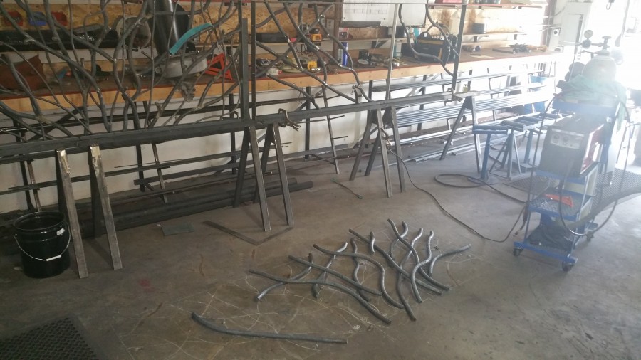 fitting and welding the branches into the actual railing frame 