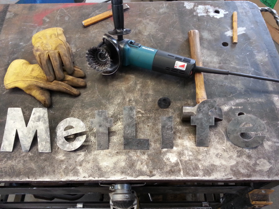 All of the letters have been forged, textured and the posts have been welded on the back of them