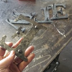 welding the rivets to the letters