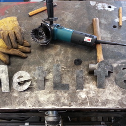 All of the letters have been forged, textured and the posts have been welded on the back of them